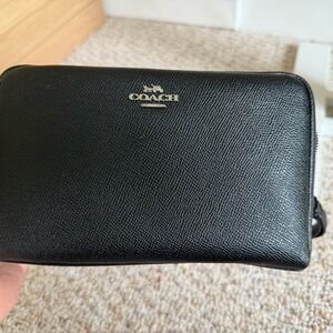 Coach black pebbled leather cosmetic pouch / wristlet.